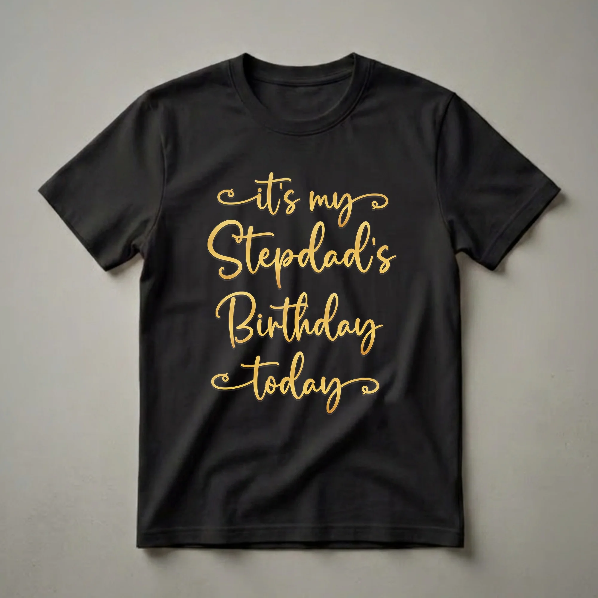 Black t-shirt with gold script text that reads 'it's my Stepdad's Birthday Today'.
