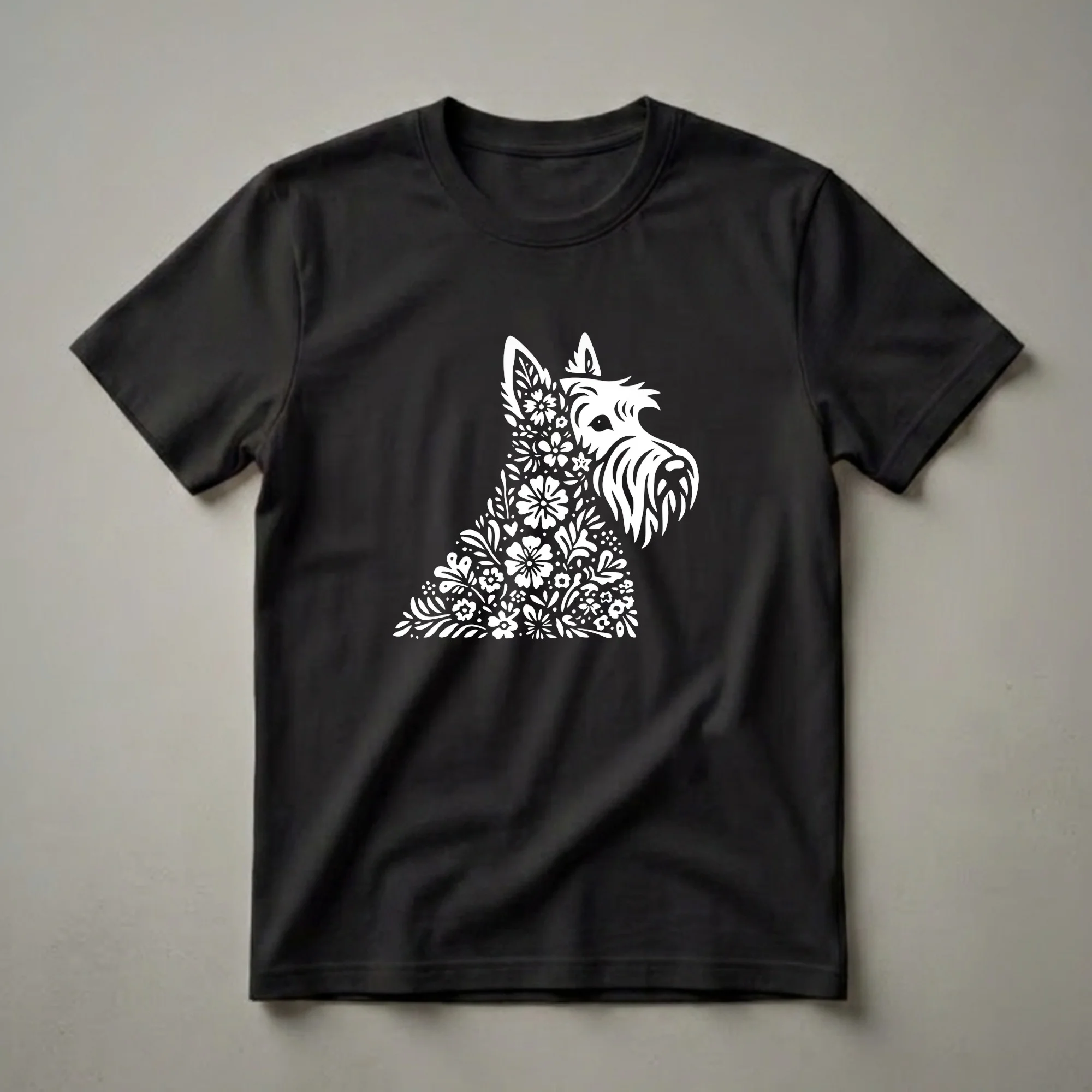 White Scottish Terrier dog graphic t-shirt design filled with floral and leaf patterns, set against a black background.