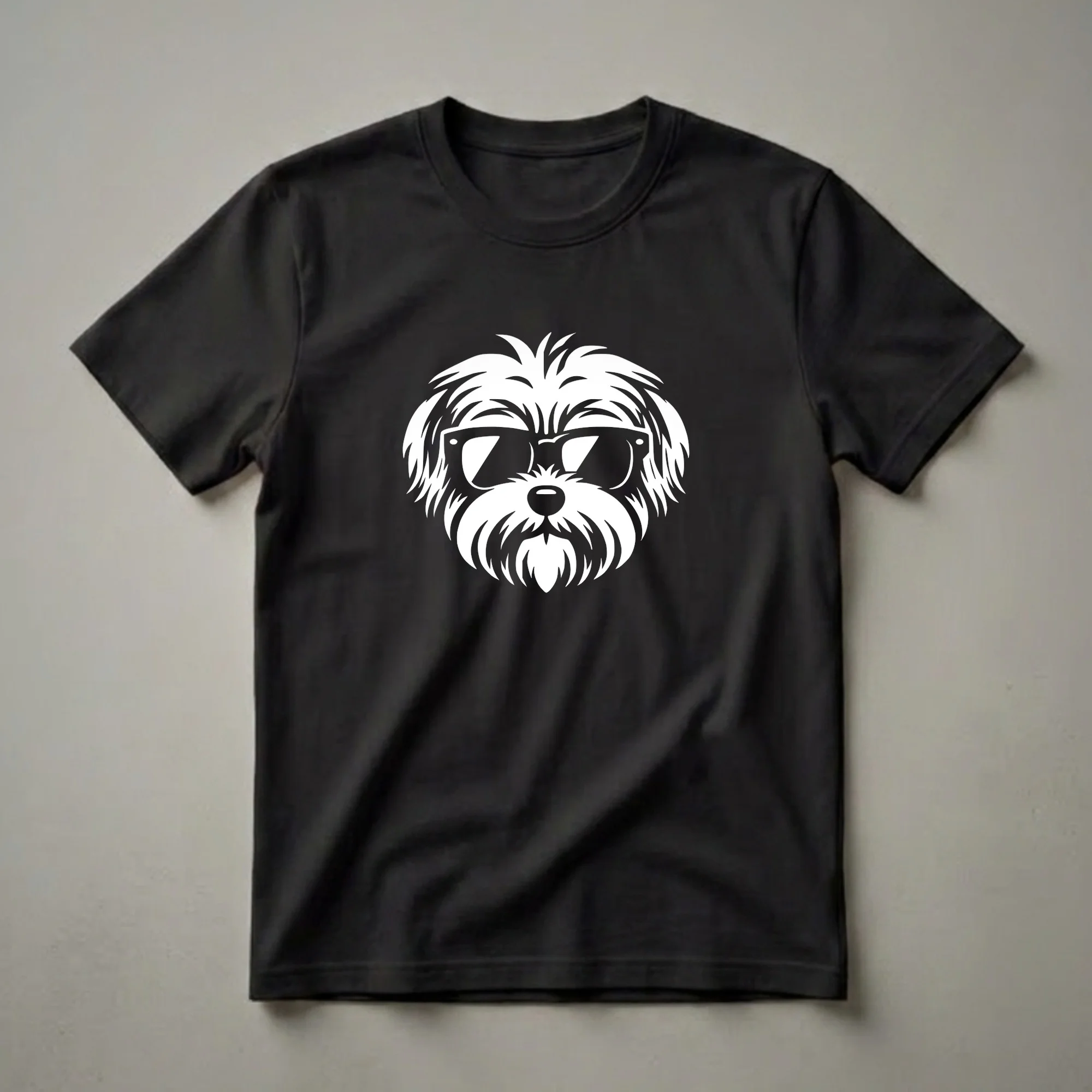 White graphic of a Morkie dog wearing black sunglasses, presented on a black t-shirt.