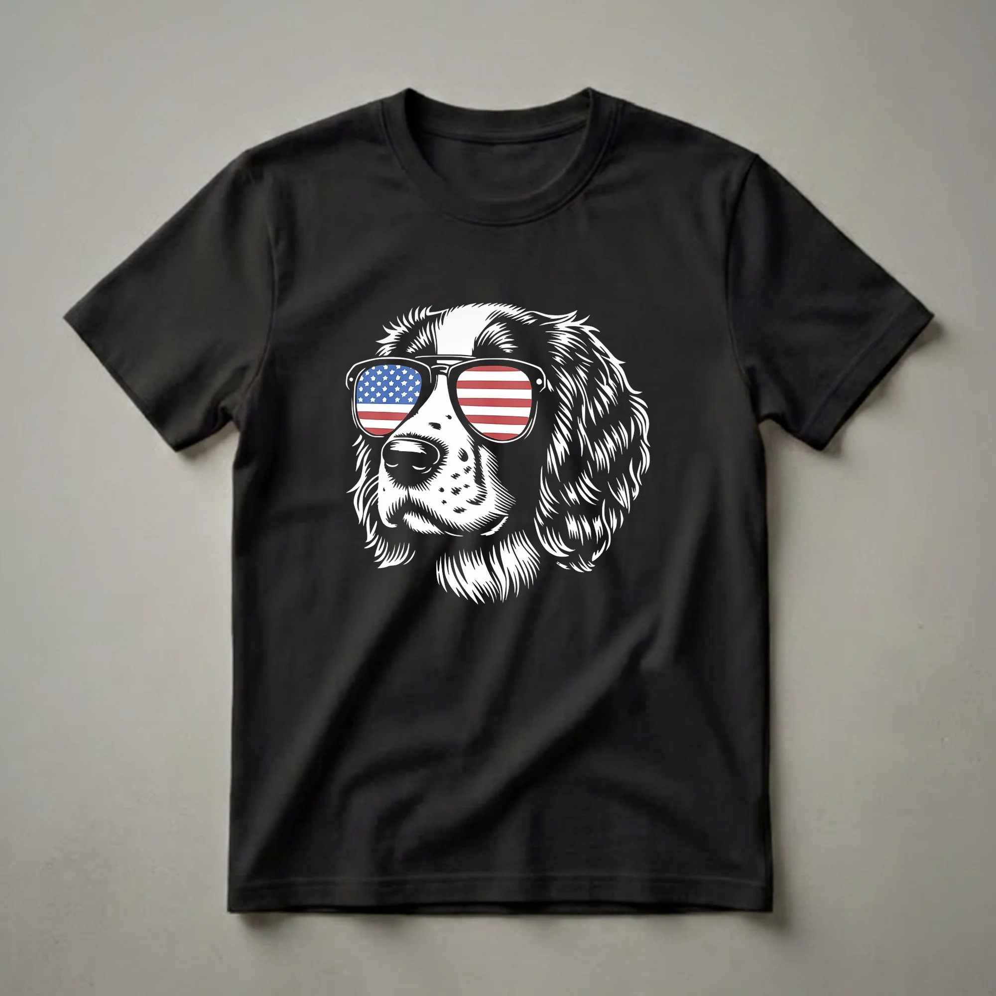 Black and white graphic t-shirt featuring the head of an English Springer Spaniel wearing sunglasses with the American flag reflected in the lenses.