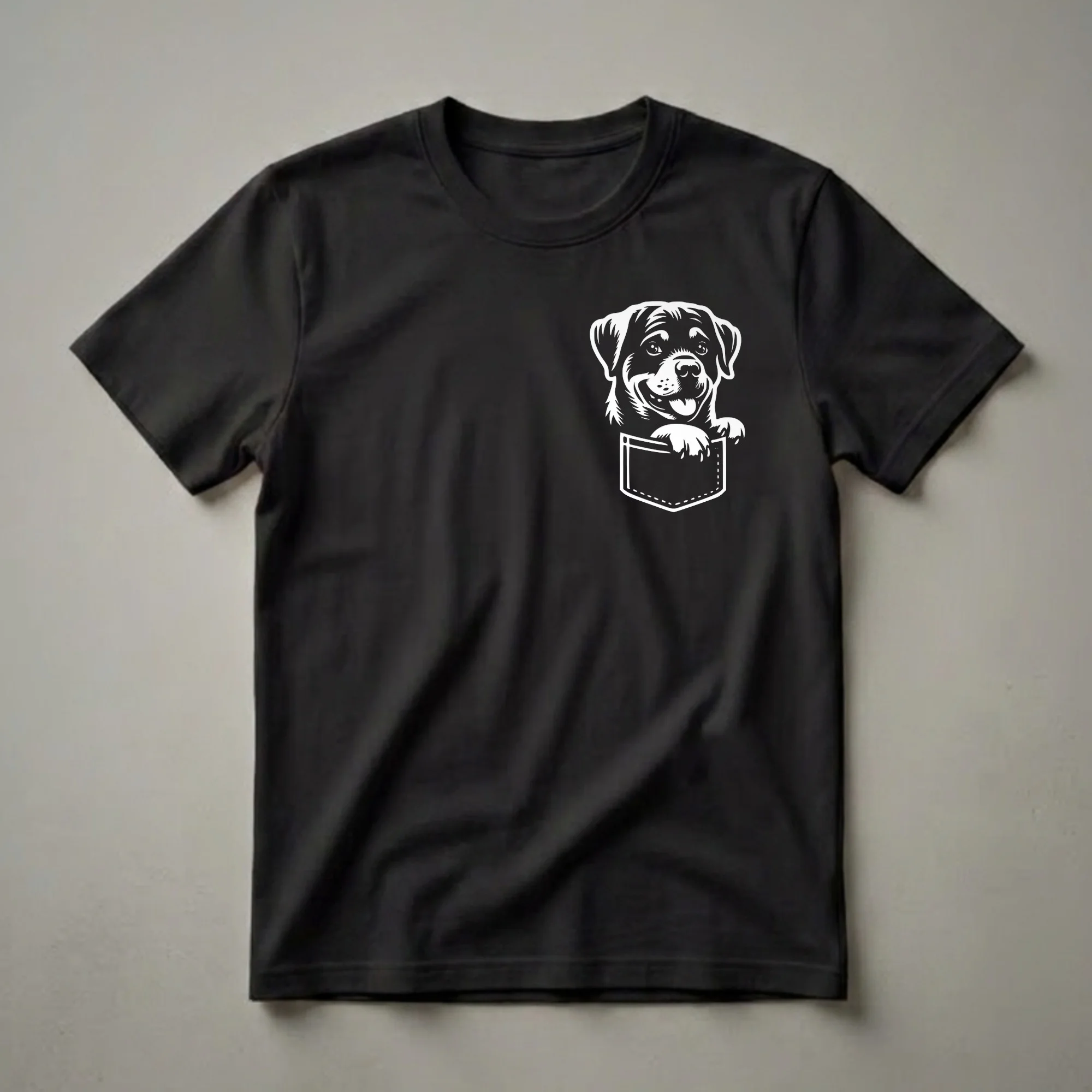 White graphic of a happy Rottweiler puppy peeking out of a faux chest pocket on a black t-shirt.