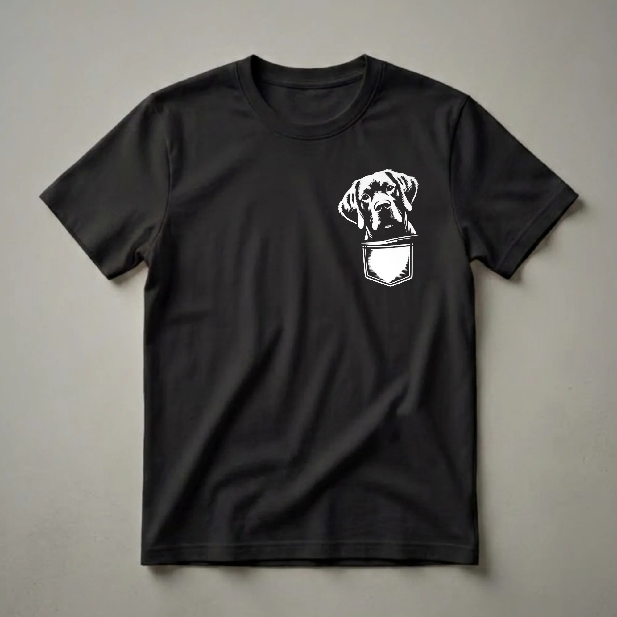 White graphic of a Chesapeake Bay Retriever dog peeking out of a pocket on a black t-shirt.