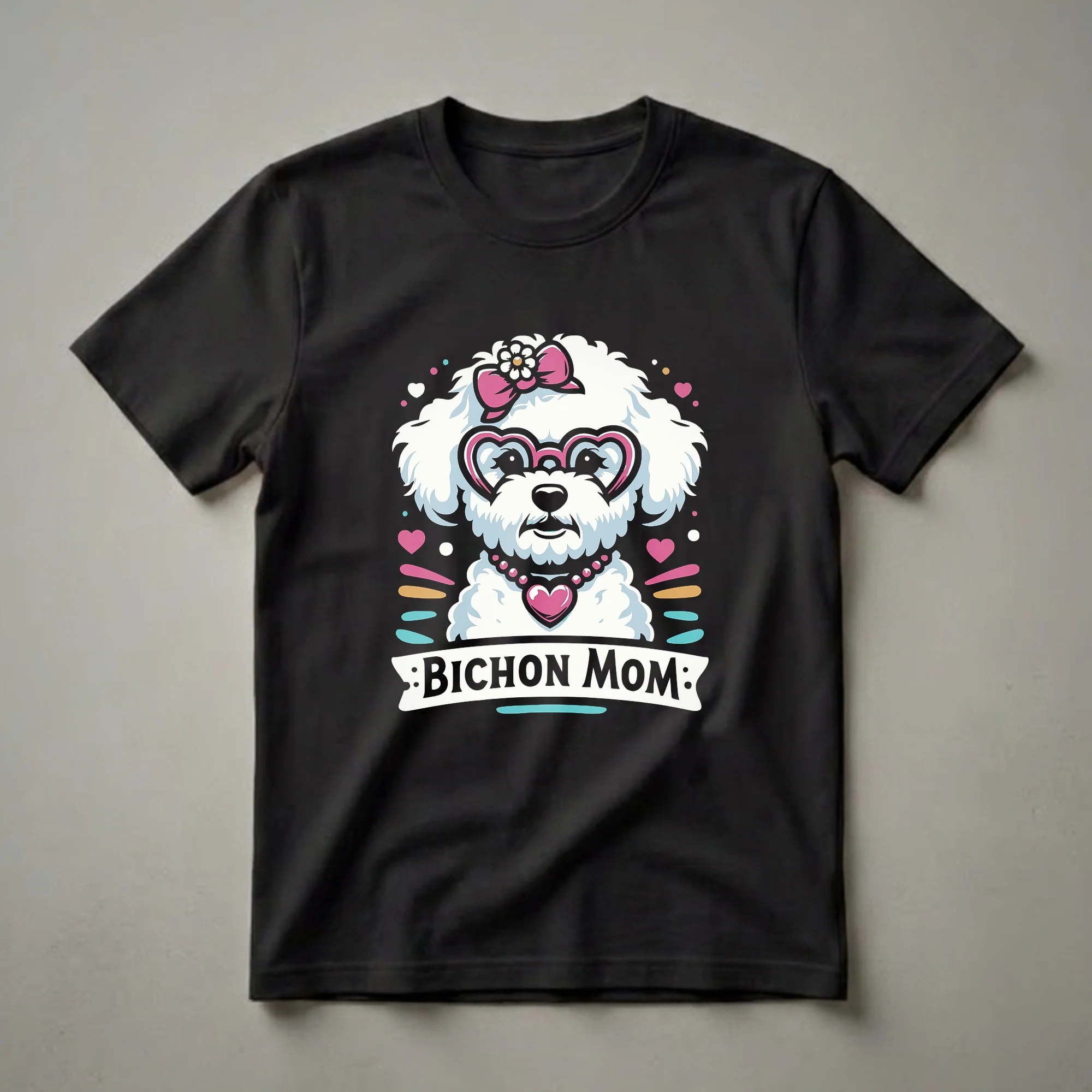 White Bichon Frise dog wearing pink heart-shaped glasses, a pink bow with a flower, and a pink beaded necklace with a heart pendant, with the text 'BICHON MOM' below, on a black t-shirt.