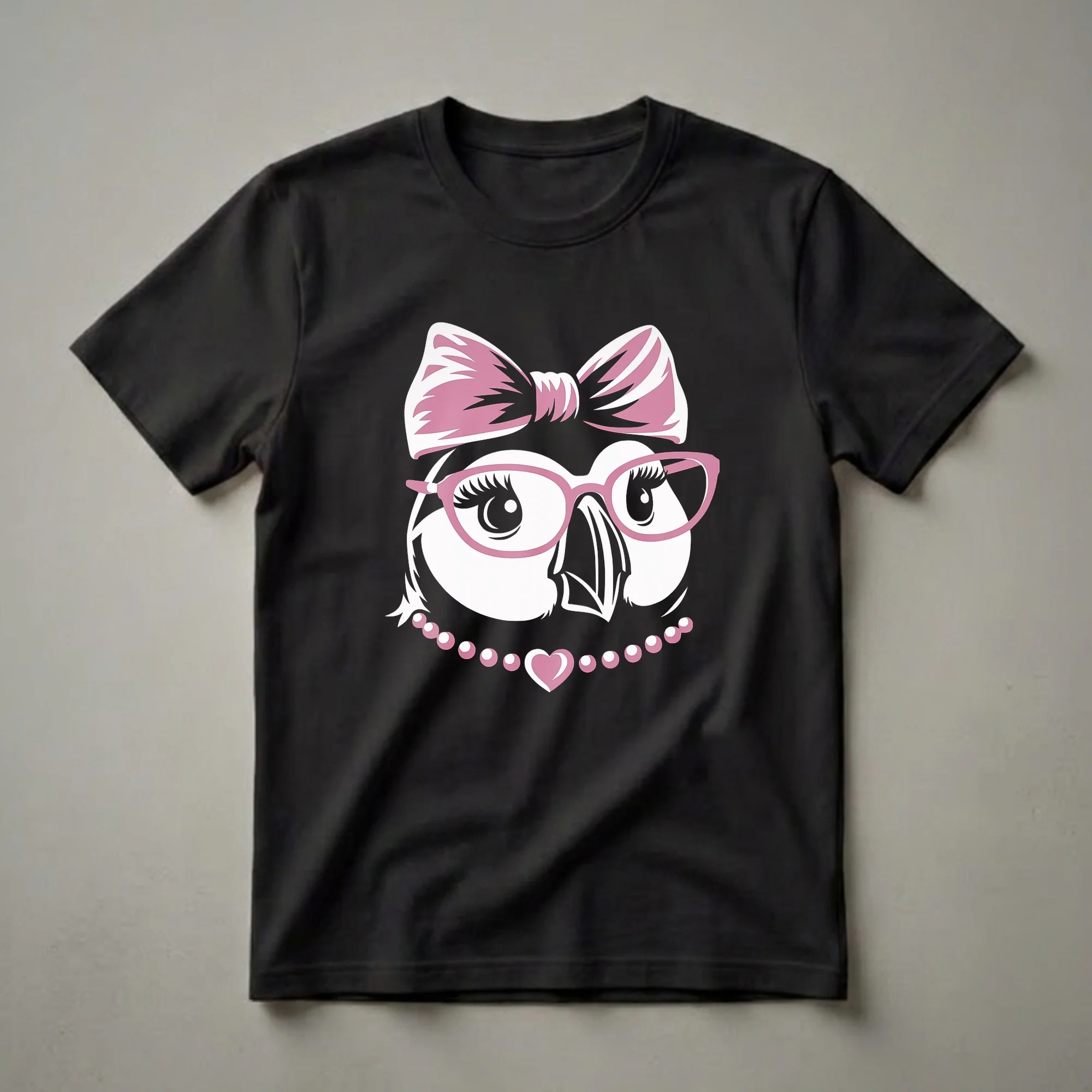 White puffin graphic t-shirt with pink bow, pink glasses, and a pearl necklace with a heart pendant.