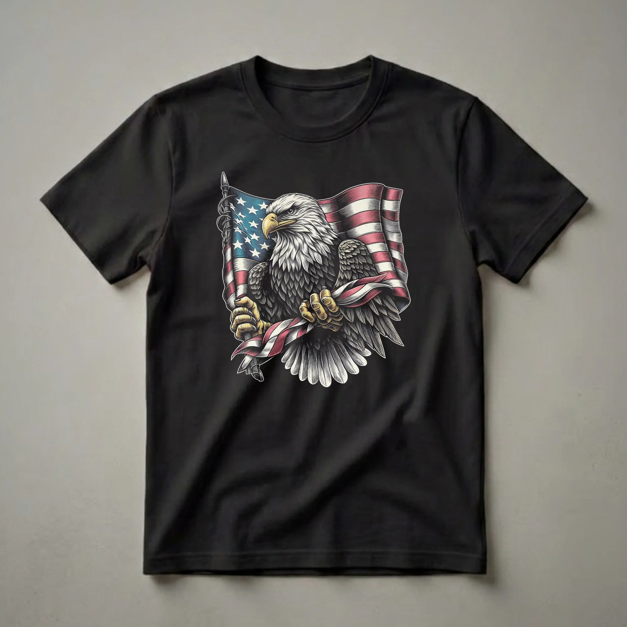 Black t-shirt with a detailed full-color bald eagle gripping a waving American flag pole with both talons, wings partially spread, facing left with an intense gaze.