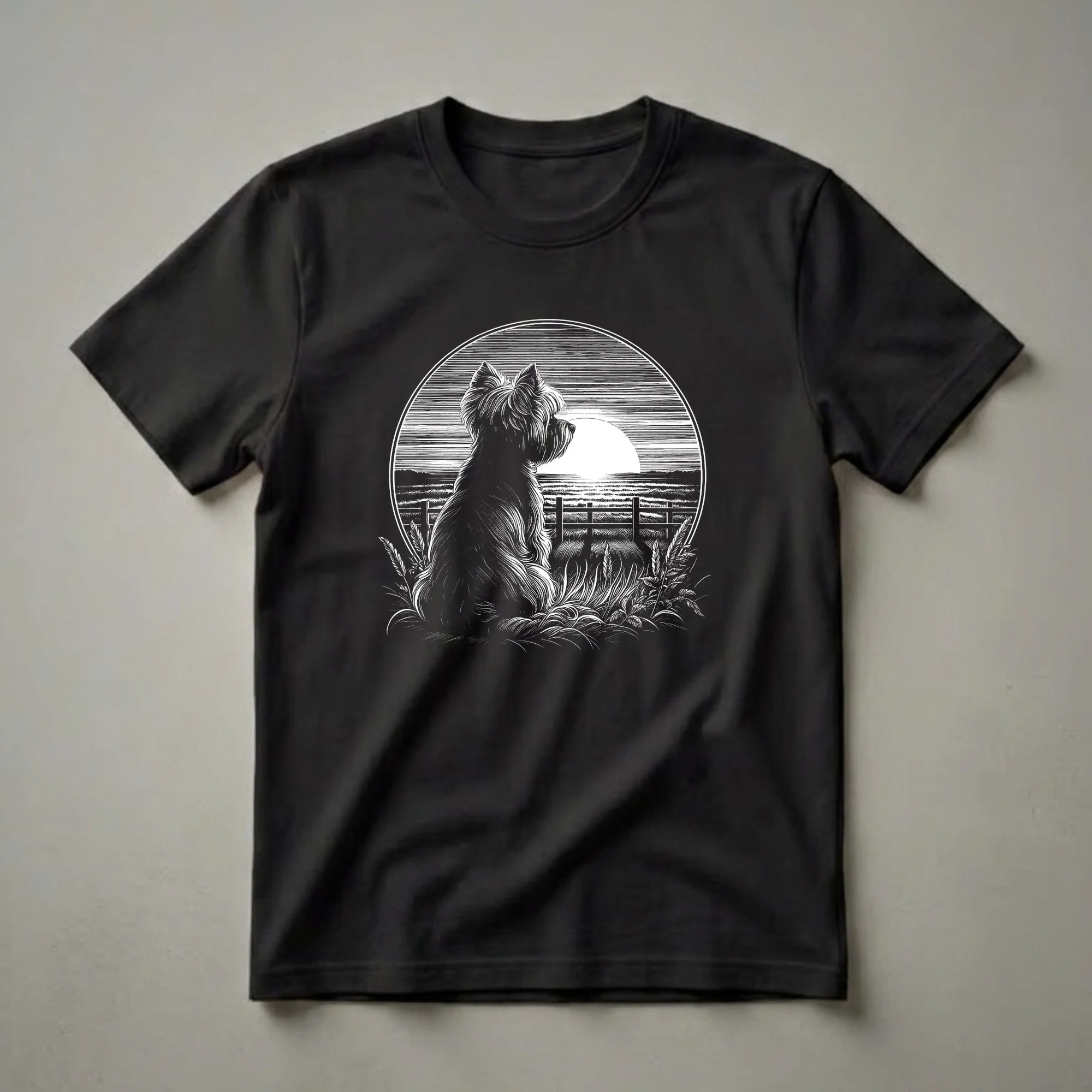 Black and white graphic t-shirt featuring a vintage illustration of a Yorkshire Terrier sitting in a grassy field looking at a sunset.