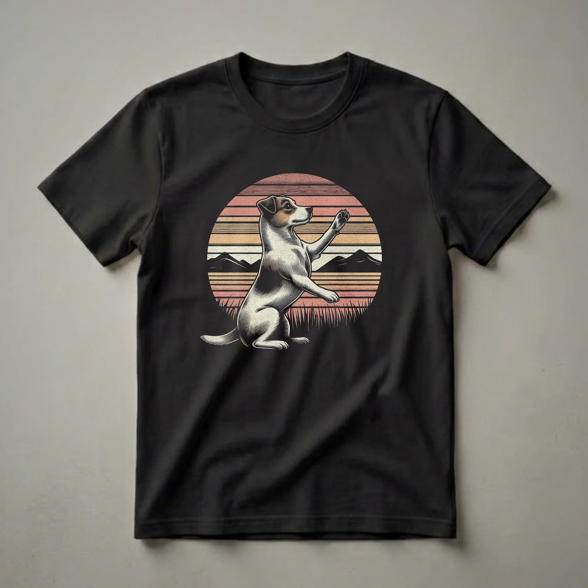 Black t-shirt featuring a vintage Jack Russell Terrier in a begging pose against a retro sunset with striped sky and silhouetted mountains and grass.