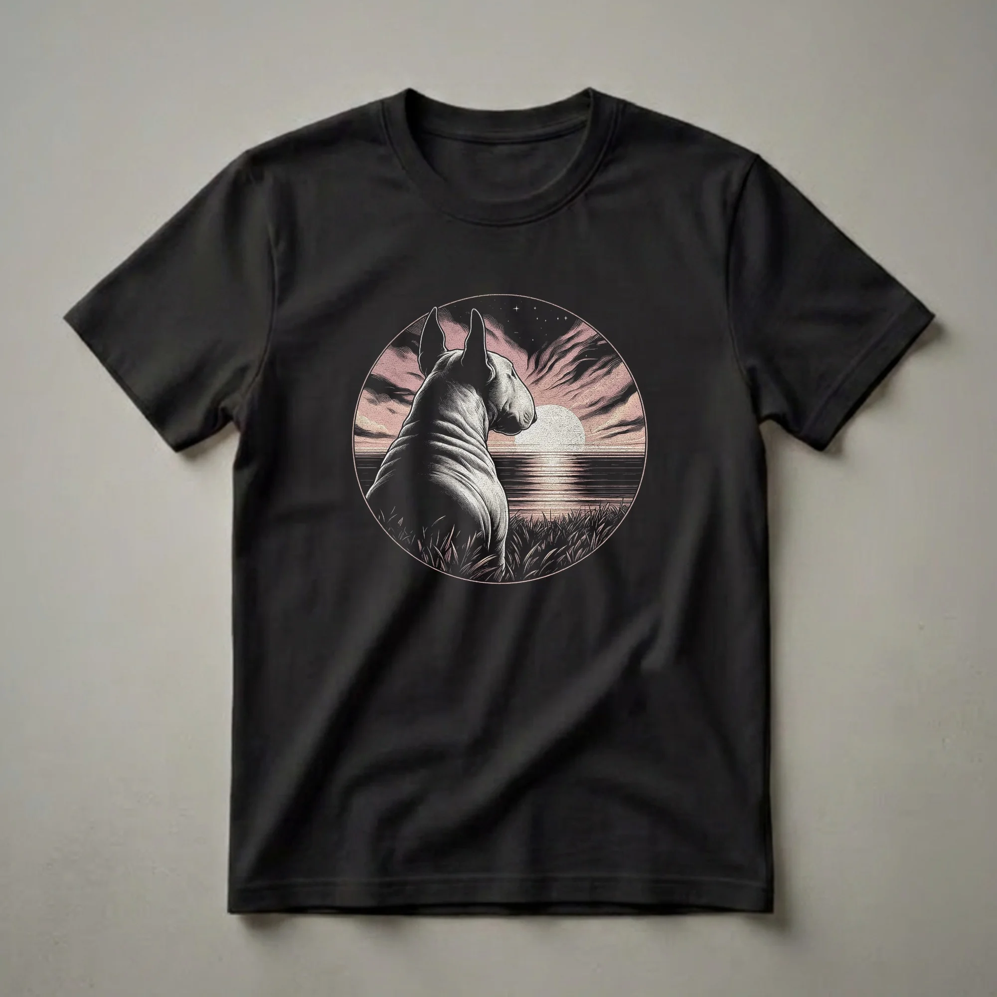 Black t-shirt featuring a vintage-style graphic of a Bull Terrier dog looking at a retro sunset over water, with grass in the foreground and stars in the sky.