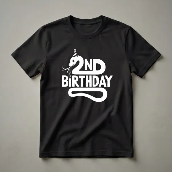 White graphic of a cartoon snake wearing a party hat and streamers, with the text '2ND BIRTHDAY' on a black t-shirt.