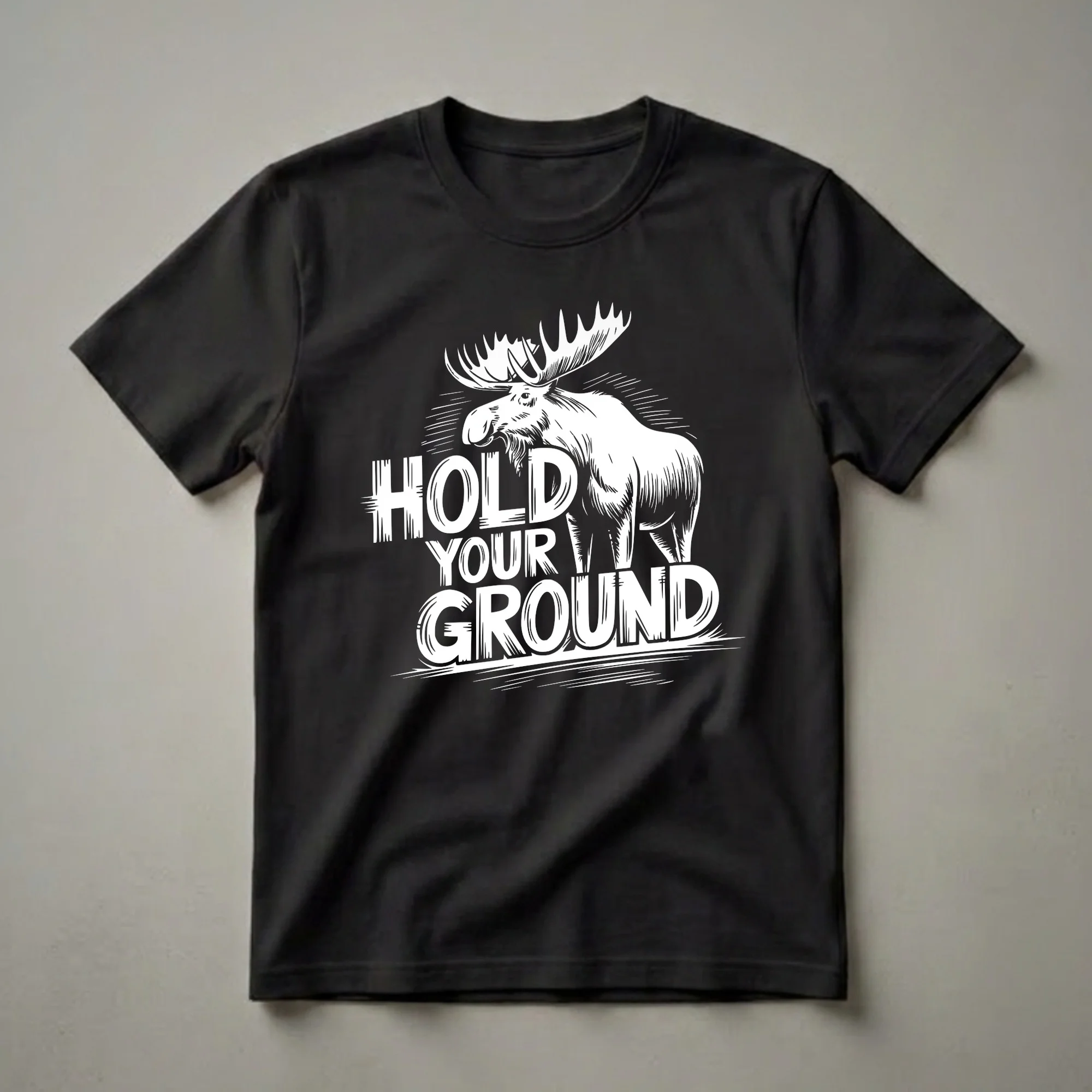 Black t-shirt with a white graphic of a bull moose with large antlers standing behind the words 'HOLD YOUR GROUND' in bold, stylized lettering.
