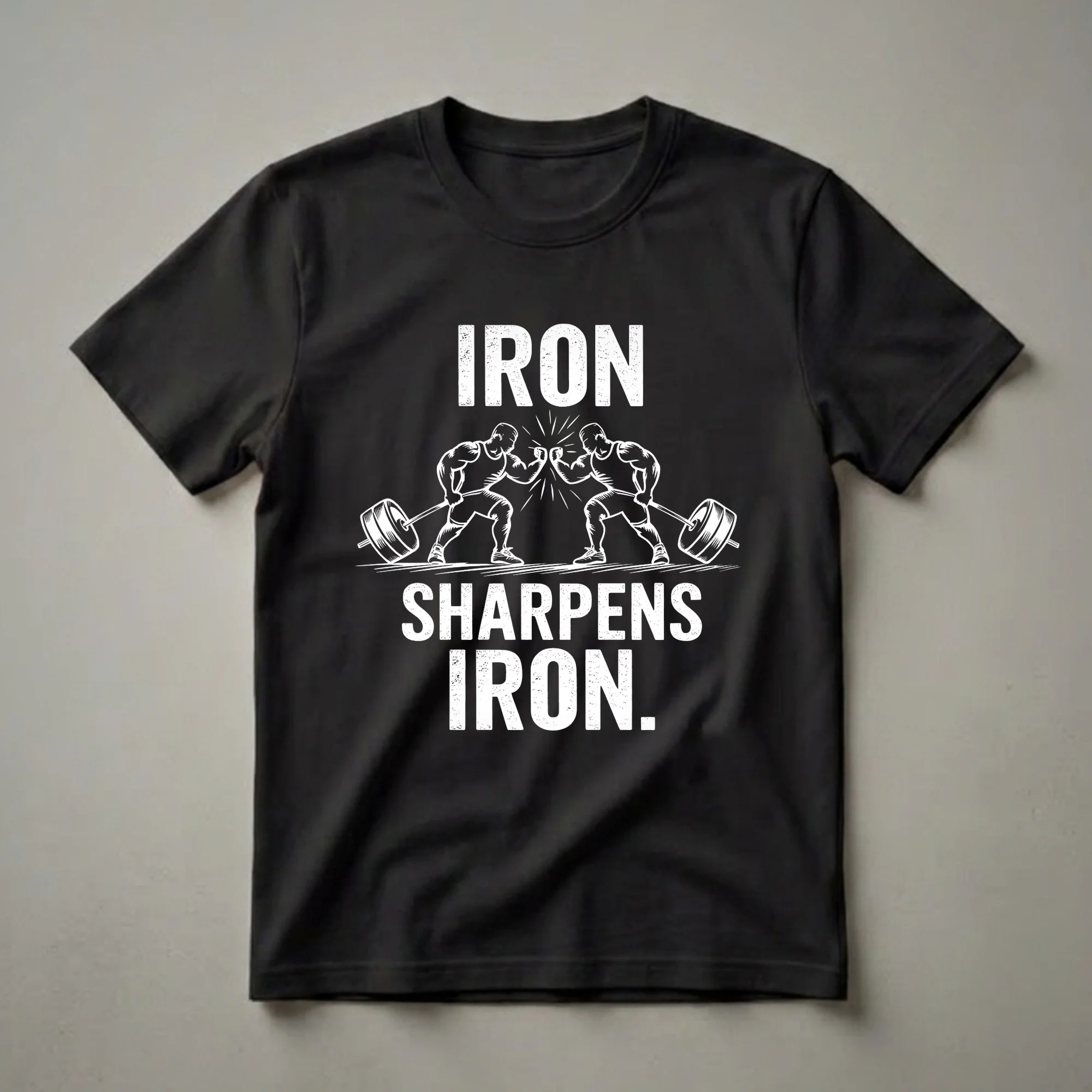 Black t-shirt with white distressed graphic of two muscular weightlifters fist-bumping over a barbell, with the text 'IRON SHARPENS IRON.'