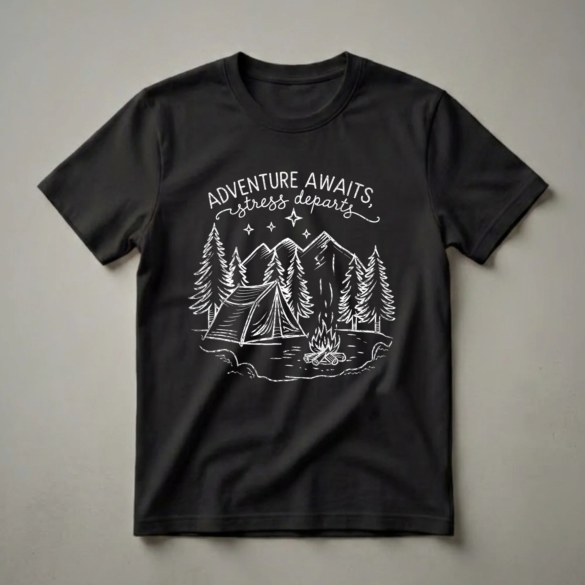 Black t-shirt with a white sketch-style graphic depicting a campsite scene with a tent, campfire, pine trees, mountains, and stars, along with the text 'Adventure Awaits, Stress Departs'.