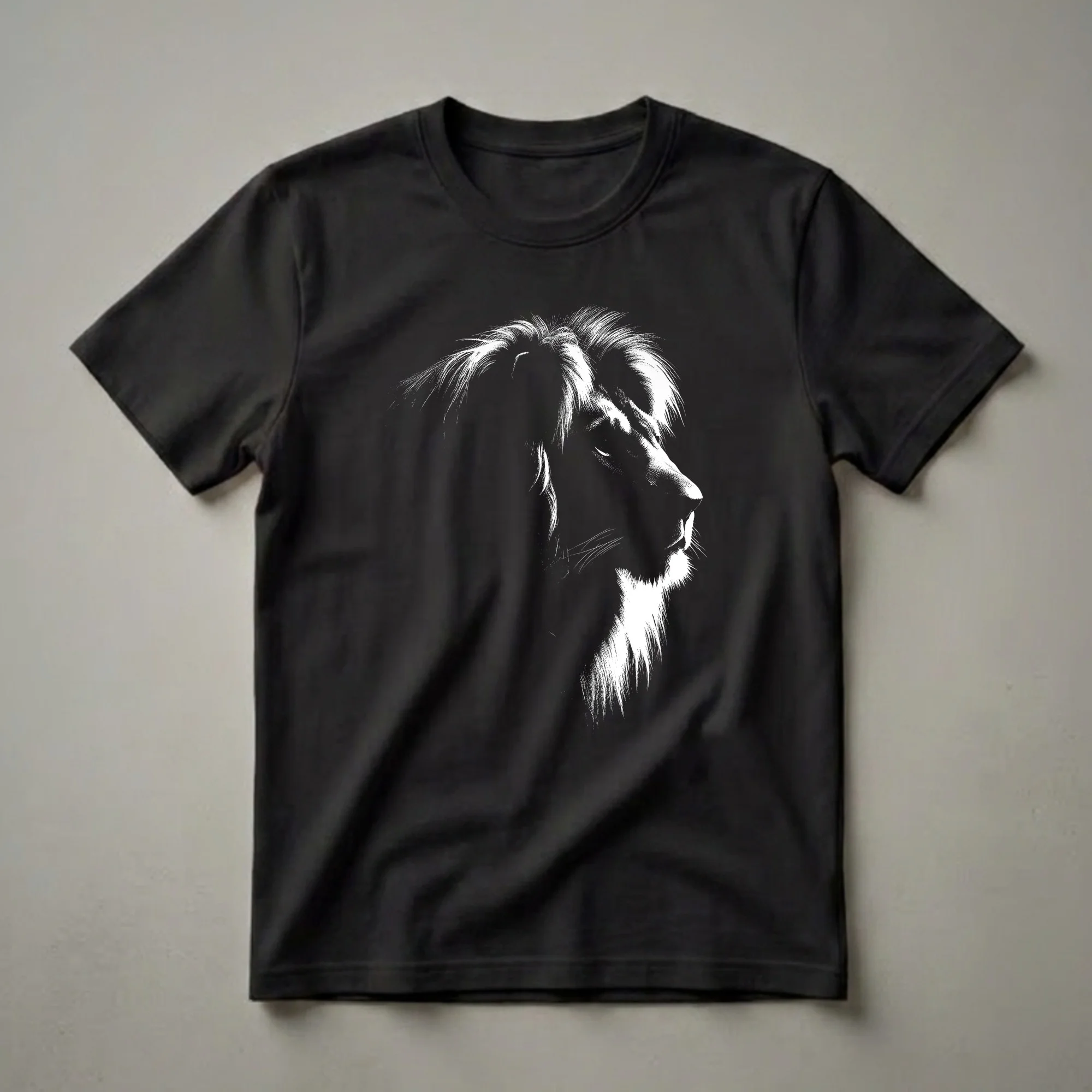 Black t-shirt with a white graphic of a lion's head in profile, showcasing its mane and facial features with a stippled texture.