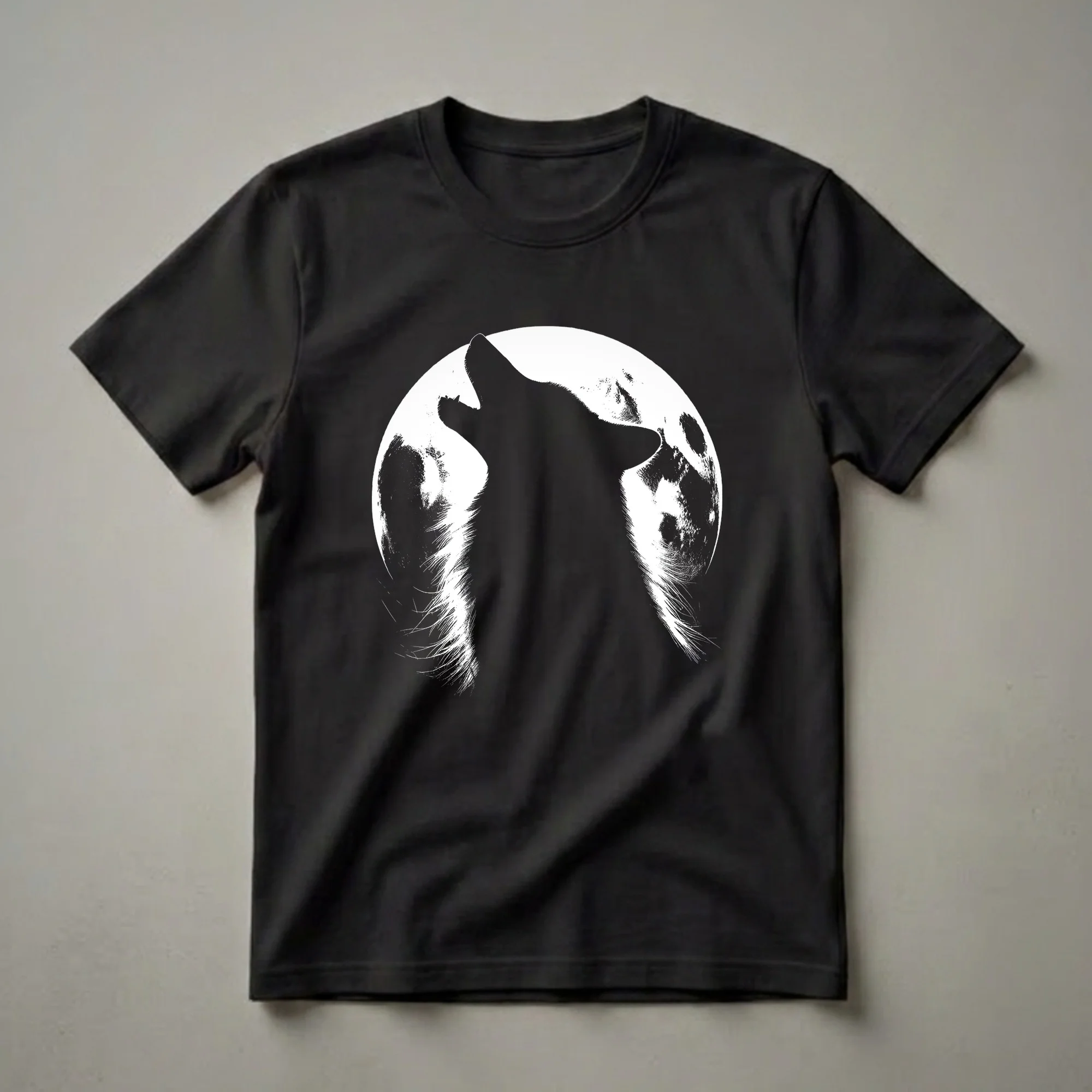 Black graphic t-shirt featuring a silhouette of a wolf howling against a textured white full moon on a black background.
