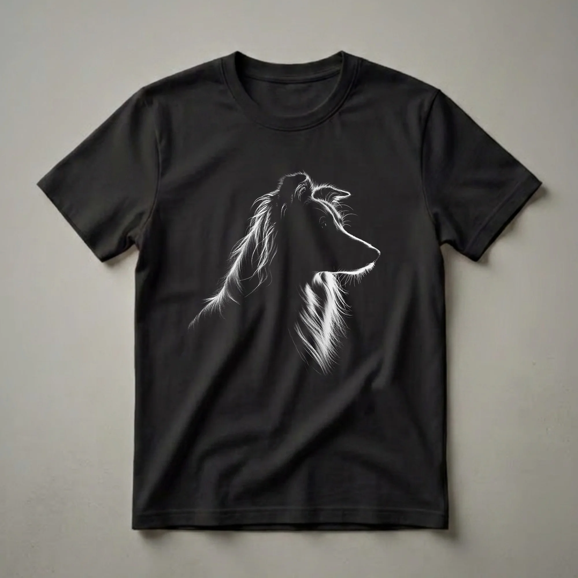 Black and white graphic illustration of a Border Collie's head in profile, featuring luminous highlights on its fur and face, on a black t-shirt.