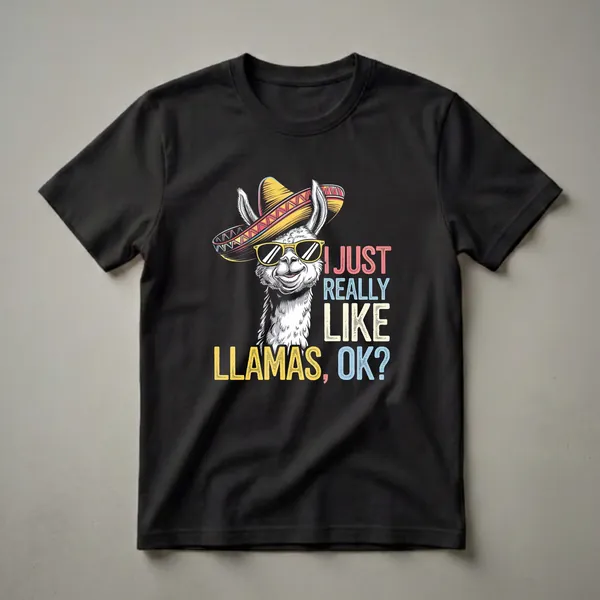 Black t-shirt featuring a white cartoon llama wearing a colorful sombrero and yellow sunglasses, with the text 'I JUST REALLY LIKE LLAMAS, OK?' in multi-colored block letters.