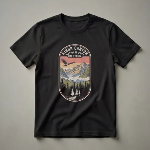 Black graphic t-shirt with a vintage arched badge design showing Kings Canyon National Park California with granite cliffs, river, pine trees, and a bald eagle in monochrome tones.