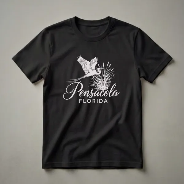 Black t-shirt with a white graphic design of an egret flying over reeds, with 'Pensacola FLORIDA' text below.