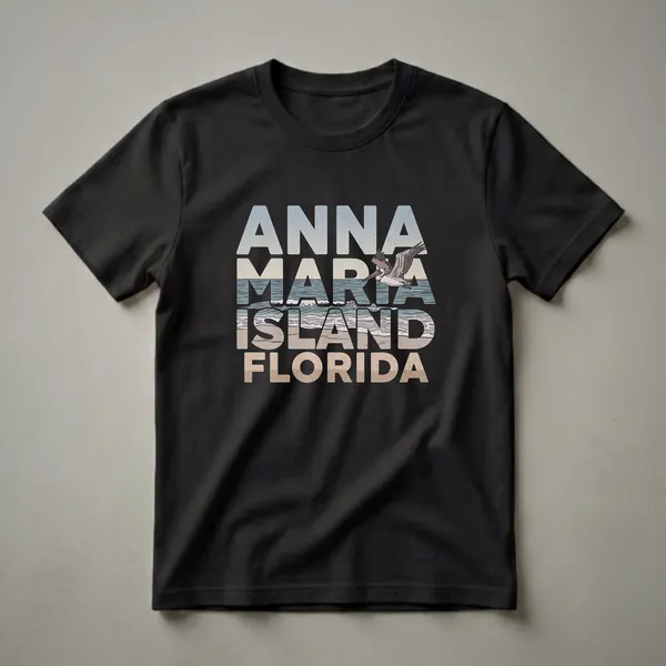 Black t-shirt with retro text 'ANNA MARIA ISLAND FLORIDA' and a pelican flying over a stylized beach and ocean waves.