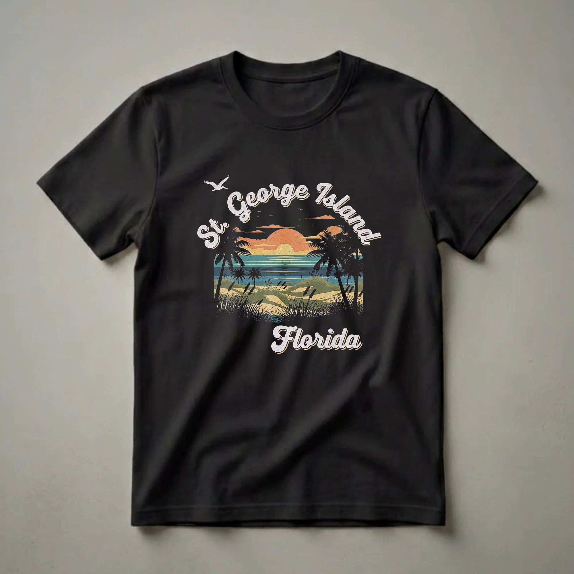Black t-shirt featuring a retro graphic design of a St. George Island, Florida sunset with palm trees, sand dunes, and the ocean.