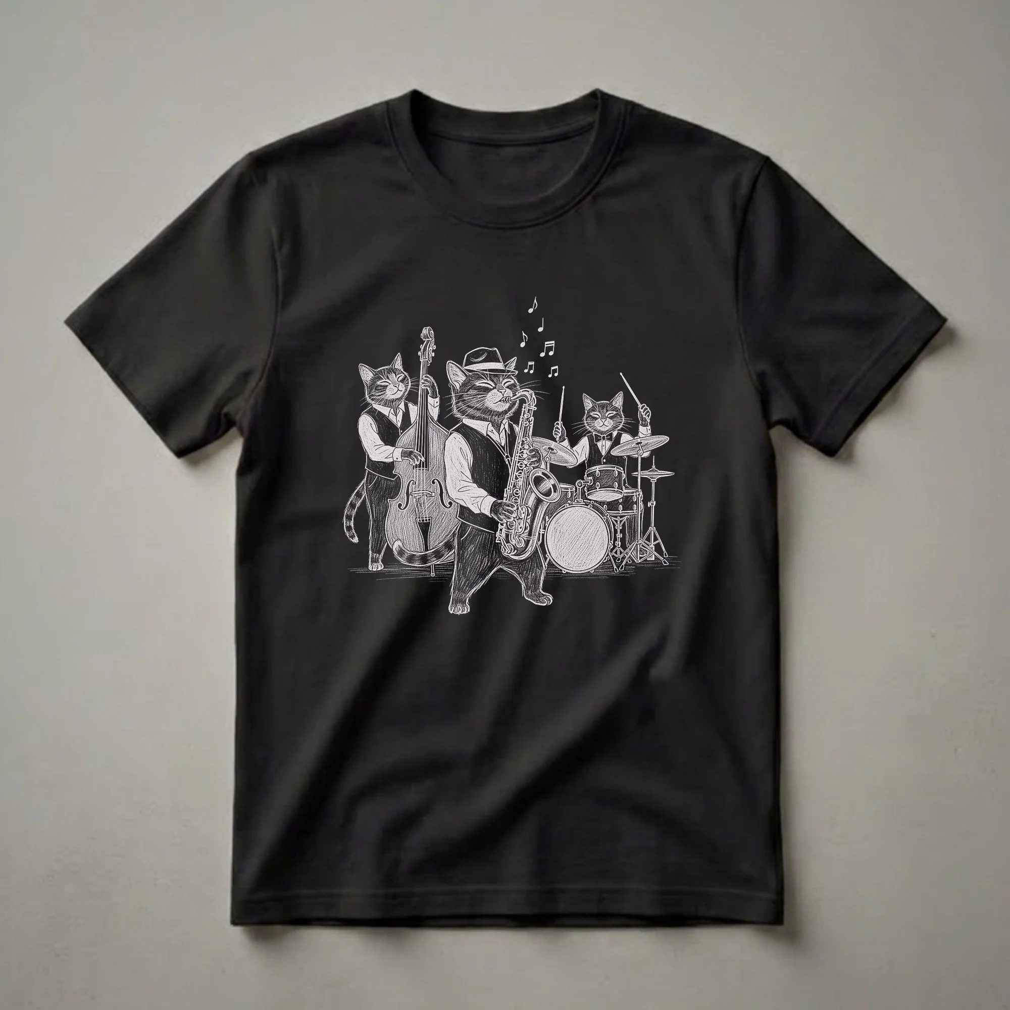 Black t-shirt with a white sketch-style illustration of three anthropomorphic cats playing jazz instruments: a saxophone player, a drummer, and a double bass player.