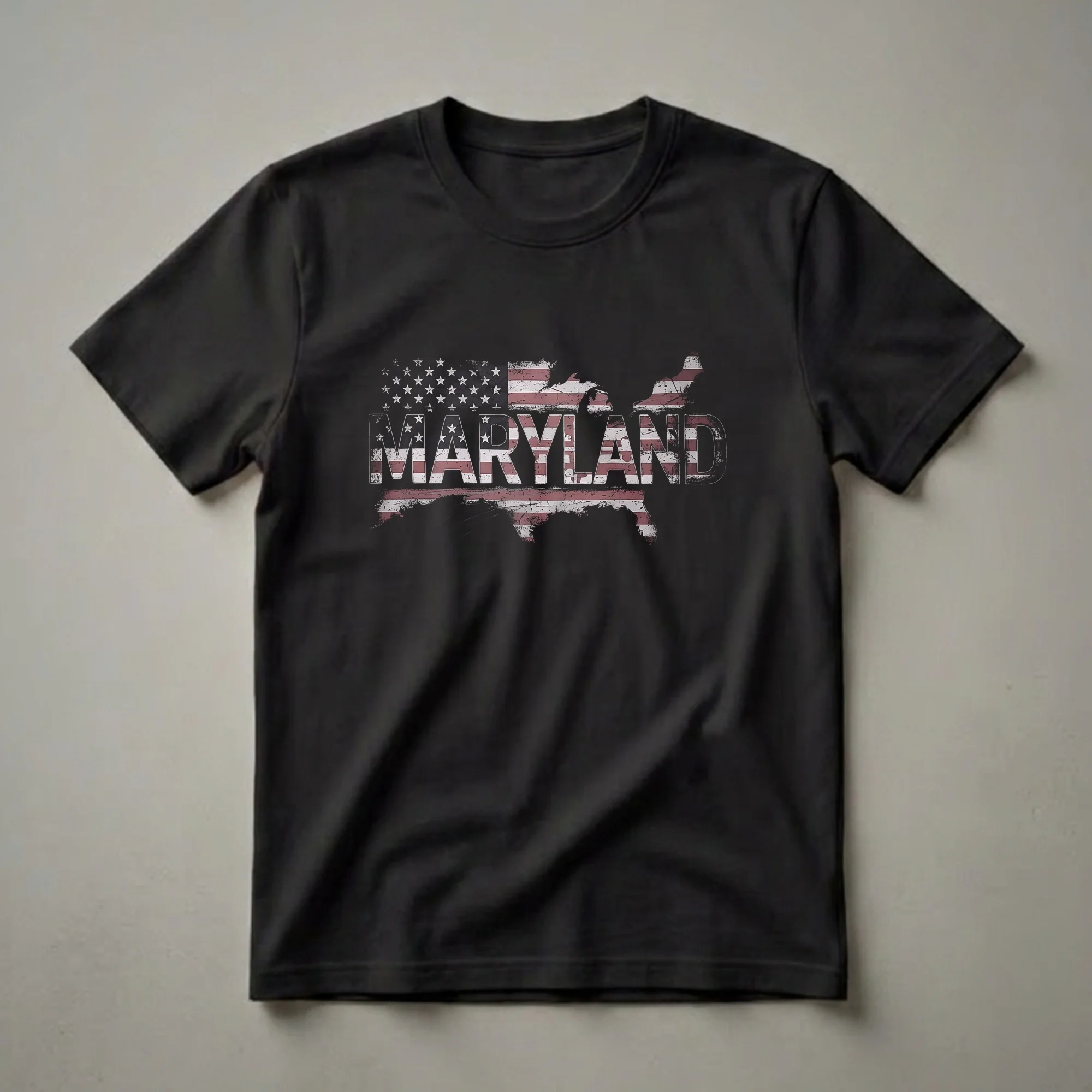 Black graphic t-shirt featuring the outline of Maryland filled with a distressed American flag pattern and the word MARYLAND in distressed white letters.