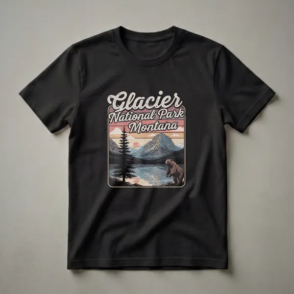 Black graphic t-shirt featuring a retro design of Glacier National Park, Montana, with a bear by a lake at sunset, mountains, and pine trees.