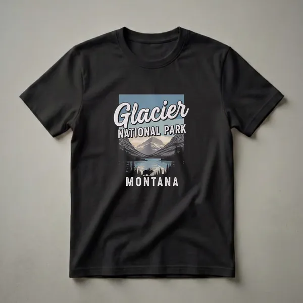 Black graphic t-shirt featuring a retro design of Glacier National Park, Montana, with mountains, a lake, evergreen trees, and a silhouetted elk.