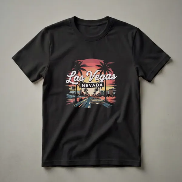 Black t-shirt with a retro graphic design of Las Vegas, Nevada at sunset, featuring a vintage convertible, palm trees, and city skyline.